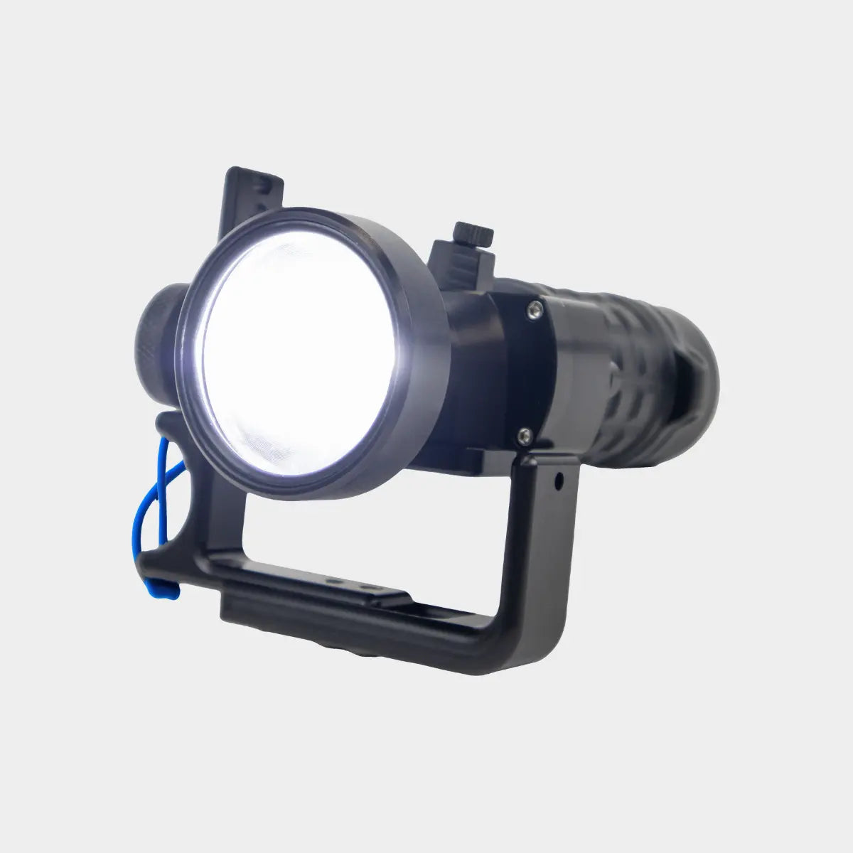 Halcyon Black technical flashlight with a white light on a gray background